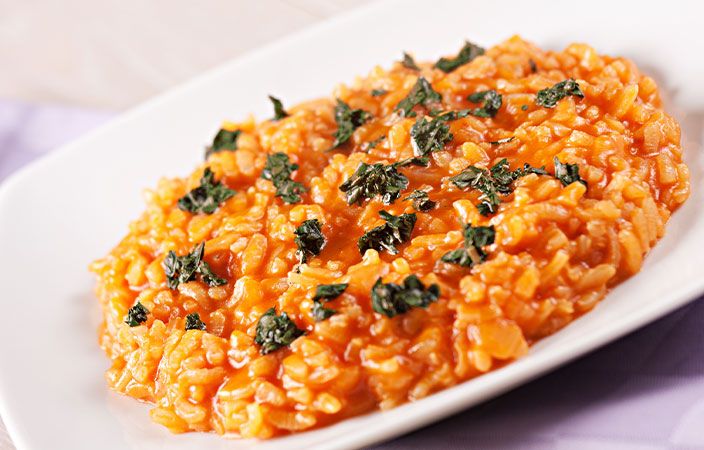 eine weisse Teller mit einer Portion Risotto  Bild auf vieni.ch